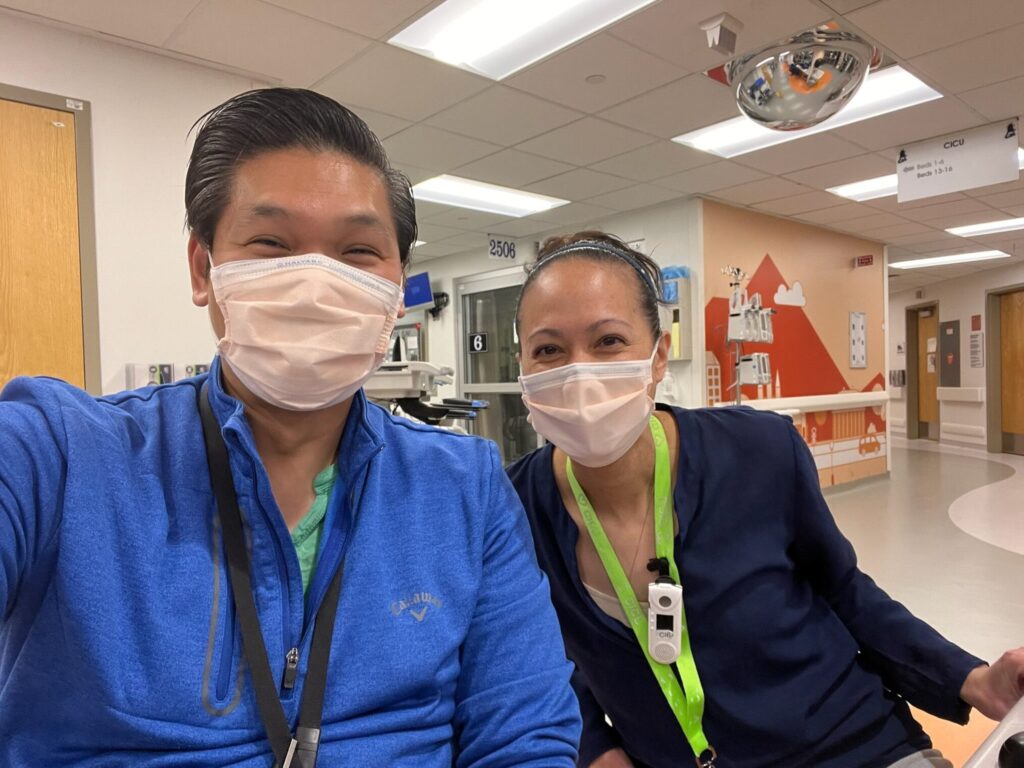 two masked colleagues enjoying a work break