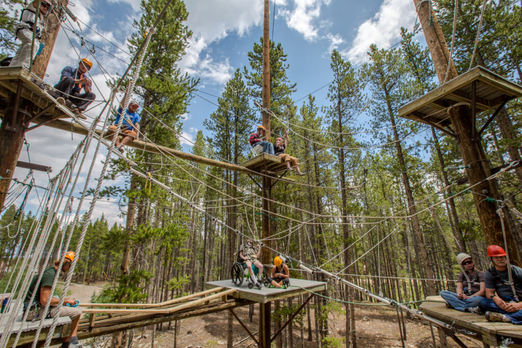 the high ropes course among the tree tops in Breckenridge, Colorado on a sunny day 